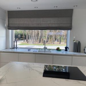 Roman blind for the kitchen made of natural grey fabric