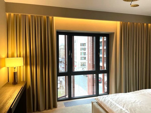 Modern trendy bedroom with curtains